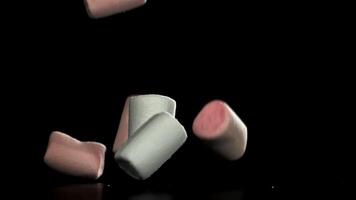 Marshmallows fall on the table. Filmed on a high-speed camera at 1000 fps. High quality FullHD footage video