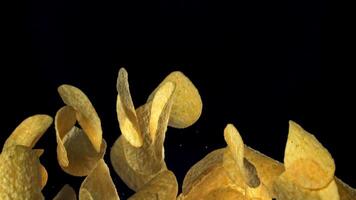 Potato chips fly up and fall down. Filmed on a high-speed camera at 1000 fps. High quality FullHD footage video