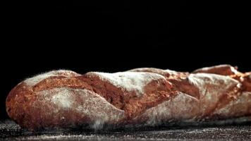 French rye baguette falls on the table. Filmed on a high-speed camera at 1000 fps. High quality FullHD footage video