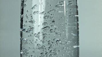 Air bubbles in a glass of water. Filmed on a high-speed camera at 1000 fps. High quality FullHD footage video
