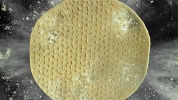 Pizza dough flies up and falls down. Filmed on a high-speed camera at 1000 fps. High quality FullHD footage video