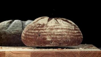 The bread falls on the table. Filmed on a high-speed camera at 1000 fps. High quality FullHD footage video