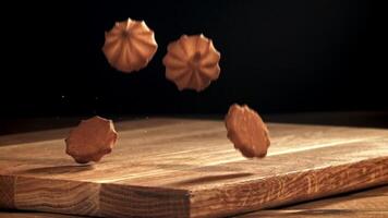 Cookies fall on a wooden table. Filmed on a high-speed camera at 1000 fps. High quality FullHD footage video