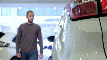 Man steps into a stylish crossover at the dealership video