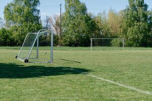 Empty Soccer Field with Separated Goalposts photo