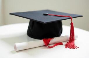 Graduation cap and diploma on white background highlighting academic achievement photo