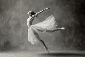 Ballerina in Mid-Air Leap, Graceful Pose with Tulle Skirt photo