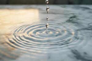 Water Droplet Creating Ripples on a Smooth Surface photo