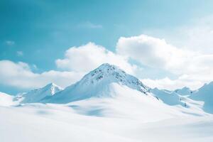 Snow-Covered Mountain Peak Against a Blue Sky photo