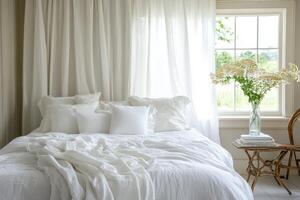White Bedding in a Bedroom with White Curtains and a Window photo