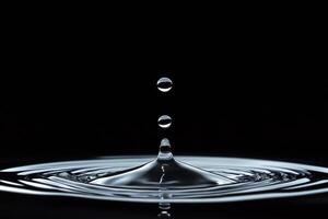 A Single Water Droplet Falling Into Still Water photo