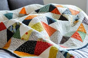 Closeup of a Colorful Patchwork Quilt on a Bed photo