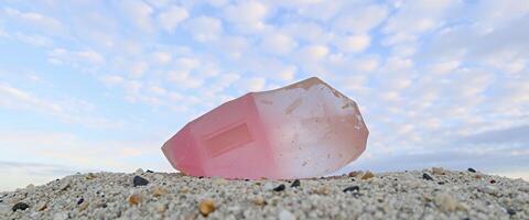 A pink rock on the sand photo