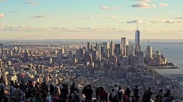 New York, USA. October 13, 2024, panoramic skyline view from observation deck with crowds and sunset light video