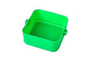 A bright green plastic storage container white background photo