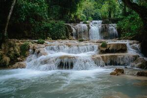 Tat Kuang Si Waterfall in Luang Prabang, Laos, a breathtaking natural tourist attraction and popular side trip destination photo