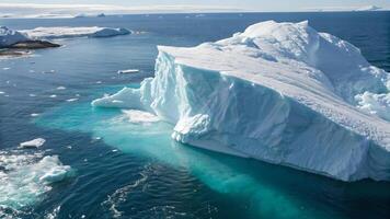 Giant Iceberg Floating in Crystal Clear Arctic Ocean Water for Nature Enthusiasts and Climate Change photo