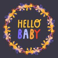 A wreath of colorful bows and the inscription hello baby on a dark background in the center vector