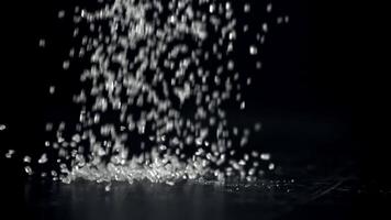 Sugar falls on the table in a heap. Filmed on a high-speed camera at 1000 fps. High quality FullHD footage video