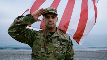 Brave Soldier On The Beach With A Wawing Flag photo
