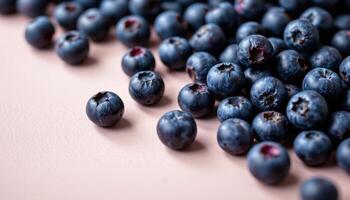 Close up of ripe blueberries scattered across a light background, each berry glowing with fresh sweetness and juicy appeal photo
