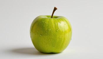 Crisp green apple on clean white background, water droplets on skin glistening under soft diffused light, healthy eating focus photo