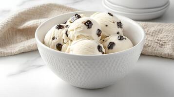 Creamy Vanilla Ice Cream Scoops with Dark Chocolate Chunks in Bowl photo