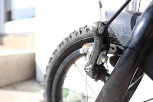 Detailed CloseUp View of a Bicycle Brake Mechanism and Wheel, Featuring Its Various Elements photo