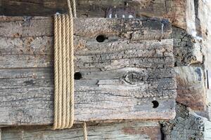 Rustic Wood Planks Beautifully Bound with Twine, Adding Charm and Character to Spaces photo
