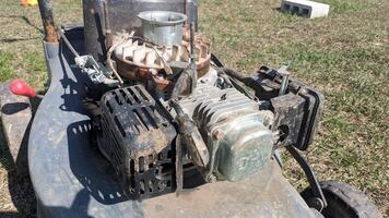 A CloseUp View of a Small Engine on a Lawn Mower, capturing intricate details and components photo