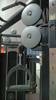A CloseUp of a Gym Cable Machine used for Effective Strength Training Exercises and Workouts photo