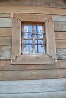 A Charming Rustic Window Featuring Beautiful Decorative Bars That Enhance Its Appeal photo