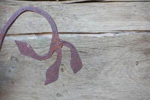 Rustic Iron Leaf Design Crafted with Care on Beautiful Wooden Background Setting photo