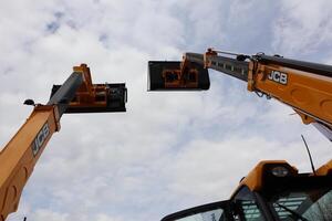 20.03.2025 Chisinau Two JCB Machines are Working Together Collaboratively at a Busy Construction Site photo