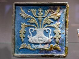 A blue and white ceramic vase with a design on it photo