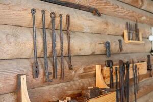 A wall with various tools hanging on it photo
