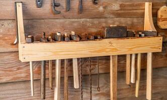 A wooden wall with tools hanging on it photo