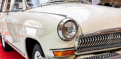 A classic car is on display at an event photo
