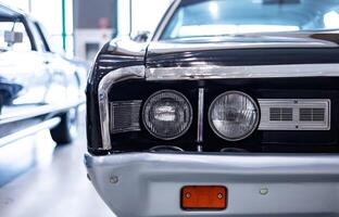 A close up of the front end of a classic car photo