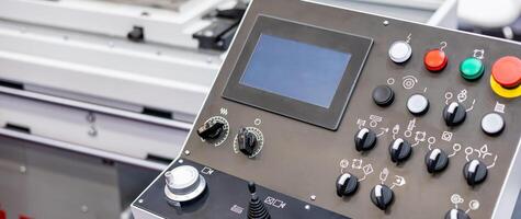 A close up of a machine with buttons and controls photo
