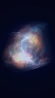 Abstract glowing energy mass in deep space, resembling a nebula or a burst of galactic light with vivid blue and orange hues video
