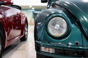 A close up of two green and red vw beetles photo