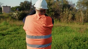 Engineer Looking In The Distance With The Project video