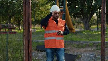 Builder With Helmet Doing The Construction Measurements video