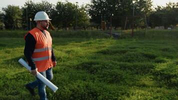 Engineer With Paper Walking In The Public Park video