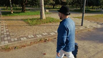 Man In The Park With A Suitcase During A Trip video