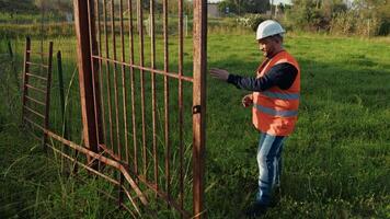 Builder Trying To Fix The Gate Door Of A Stadium video