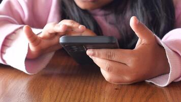 child Engaging with mobile technology at home during leisure time video