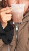 Enjoying a warm drink in a cozy setting during winter video