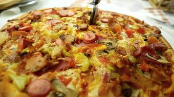 Homemade pizza with fresh toppings in a cozy spot video